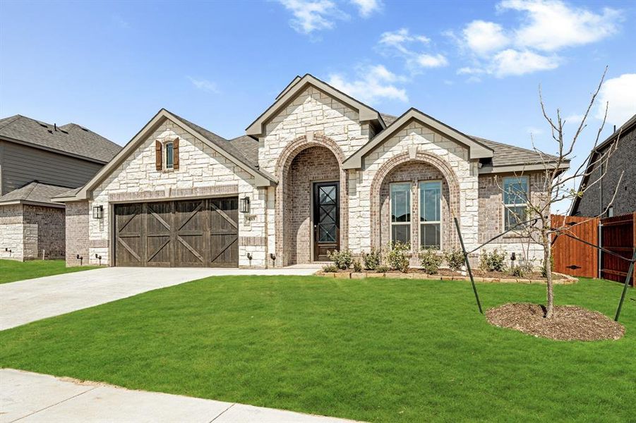 Front exterior of a new home in The Retreat at North Grove 60, Waxahachie, TX, highlighting curb appeal (Image 2).