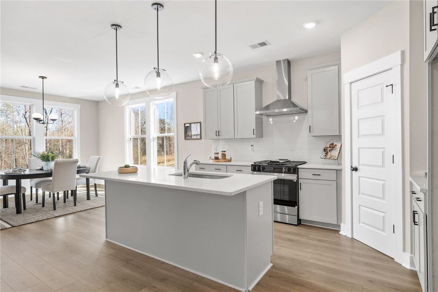 This bright kitchen features a spacious island and