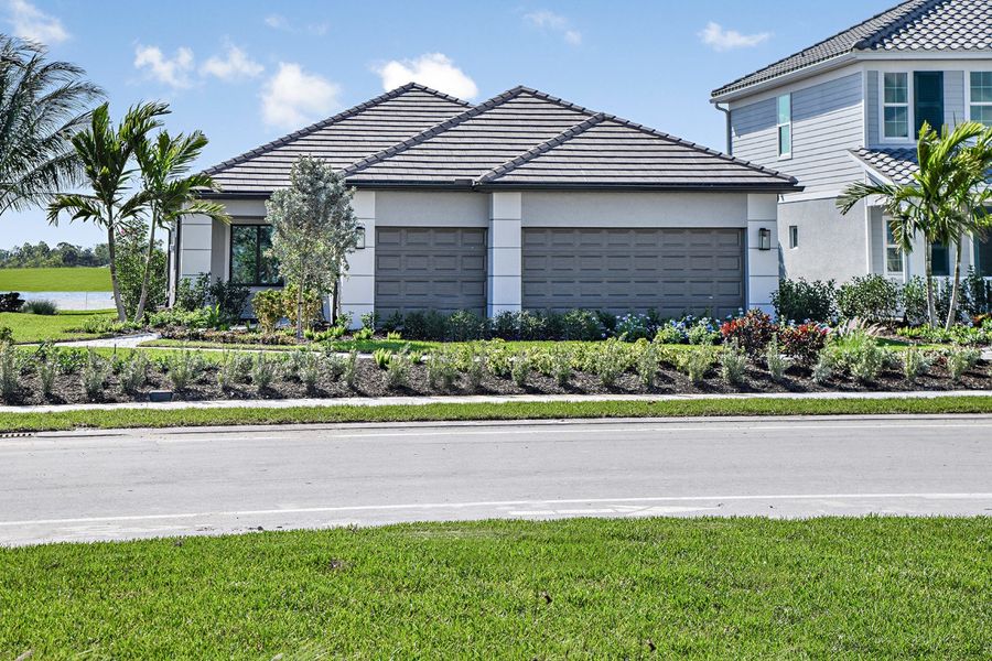 Representative exterior photo of a completed home built from the Meadow Brook by Neal Communities in SkySail, Naples, FL (Image 20).