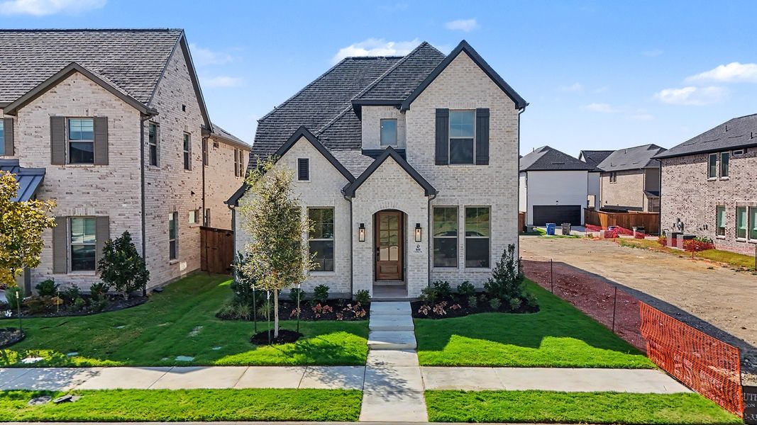 Front exterior of a new home in Light Farms Brenham - 40' Lots, Celina, TX, highlighting curb appeal (Image 23).