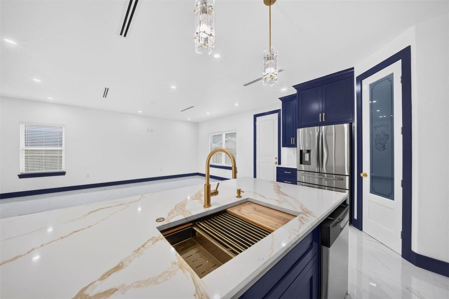 Additional kitchen view highlighting the open layout and spacious center island