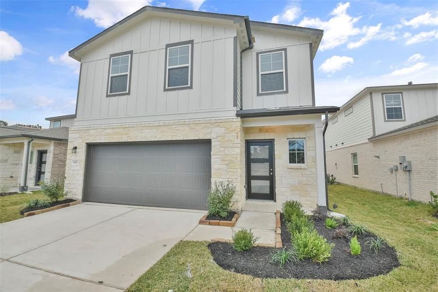 Front exterior of a new home in Lakes at Black Oak, Magnolia, TX, highlighting curb appeal (Image 38).