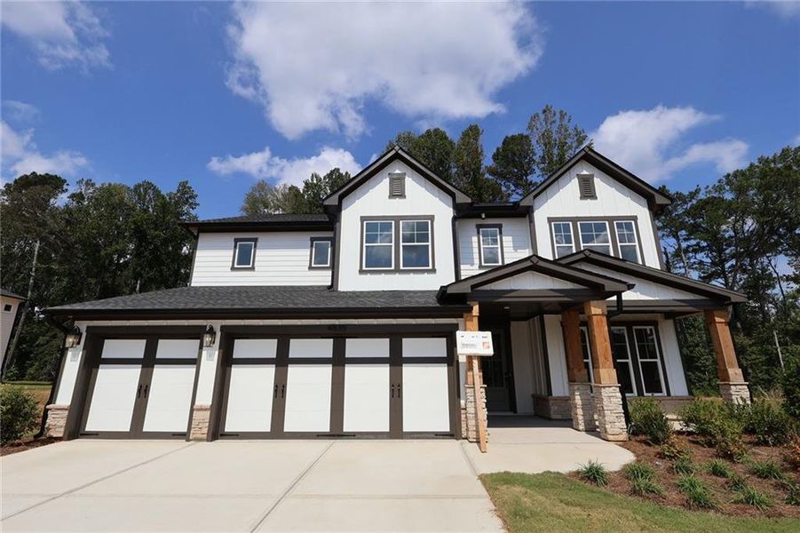 Front exterior of a new home in Settingdown Farms, Cumming, GA, highlighting curb appeal (Image 2).