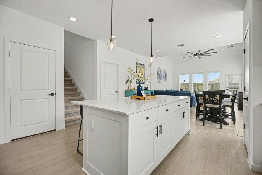 Oversized island offers additional storage, workspace, and seating while maintaining an open connection to the dining and living areas. Oversized island offers additional storage, workspace, and seating while maintaining an open connection to the dining and living areas.
