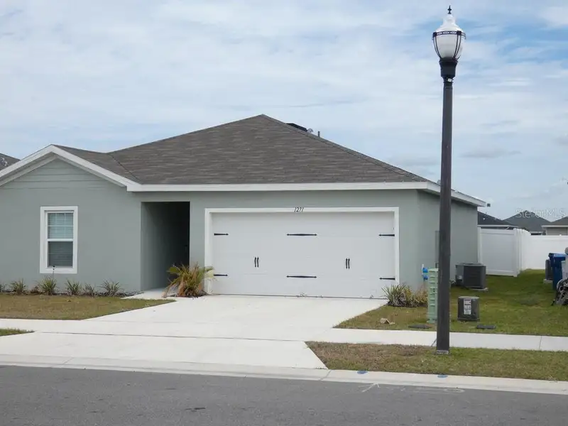 Front exterior of a new home in , Haines City, FL, highlighting curb appeal (Image 2). Front exterior of a new home in , Haines City, FL, highlighting curb appeal (Image 2).