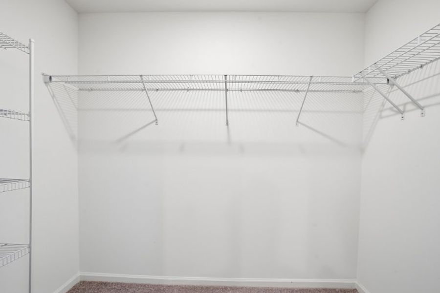 A white room with a metal railing.