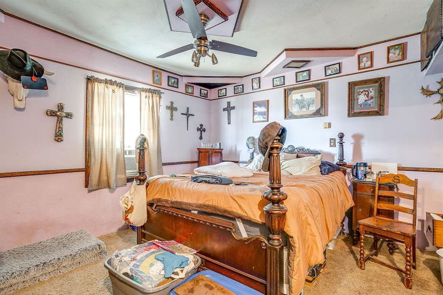 Bedroom featuring ceiling fan and carpet Bedroom featuring ceiling fan and carpet