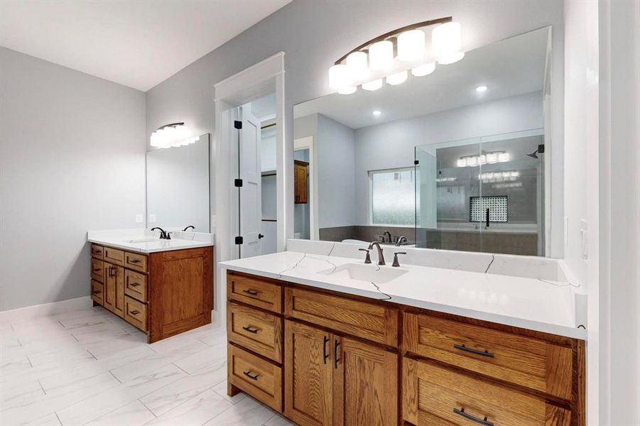 Bathroom with vanity and a shower with shower door