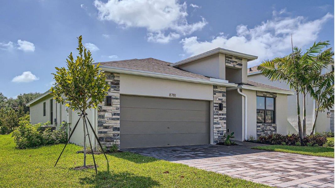 Representative exterior photo of a completed home built from the Cali by D.R. Horton in Twin Oaks, Stuart, FL (Image 2).