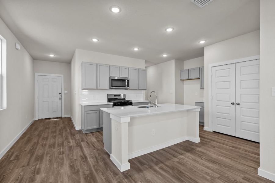 A kitchen with white cabinets. A kitchen with white cabinets.
