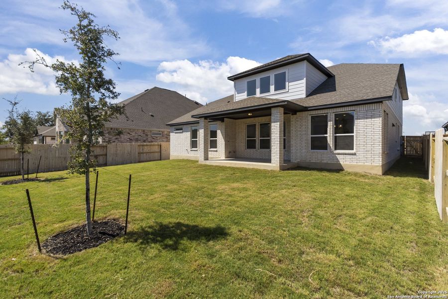 Exterior details and patio area of a home in Stillwater Ranch 60', San Antonio (Image 19).
