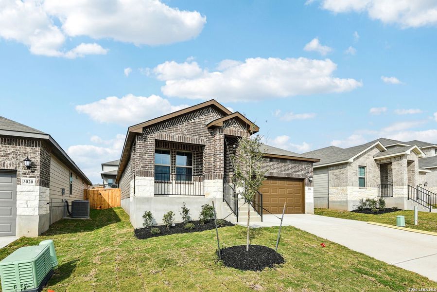 Front exterior of a new home in Lark Canyon, New Braunfels, TX, highlighting curb appeal (Image 24).