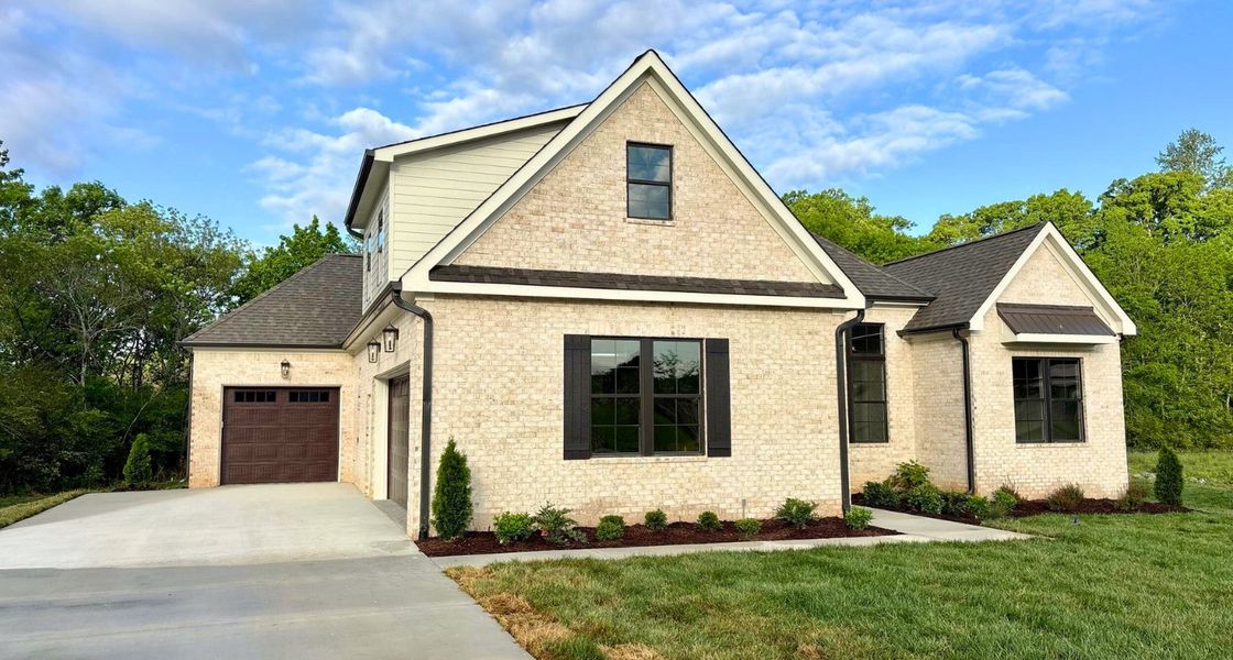 Front exterior of a new home in Creekside, Cleveland, TN, highlighting curb appeal (Image 2). Front exterior of a new home in Creekside, Cleveland, TN, highlighting curb appeal (Image 2).