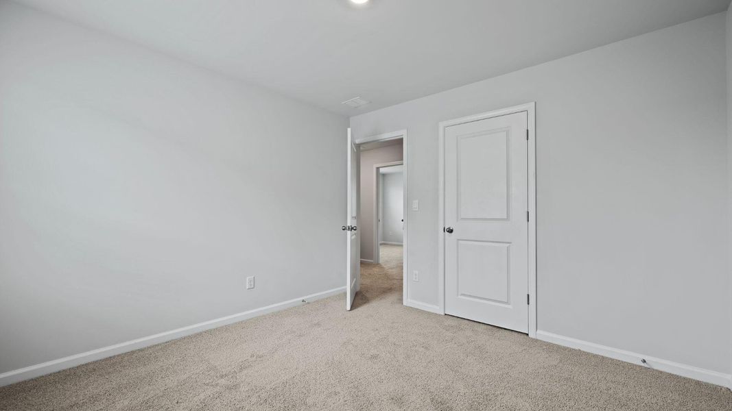 Spacious, unfurnished interior of a new home in Pine Hills at Cane Bay, Summerville (Image 13). Spacious, unfurnished interior of a new home in Pine Hills at Cane Bay, Summerville (Image 13).