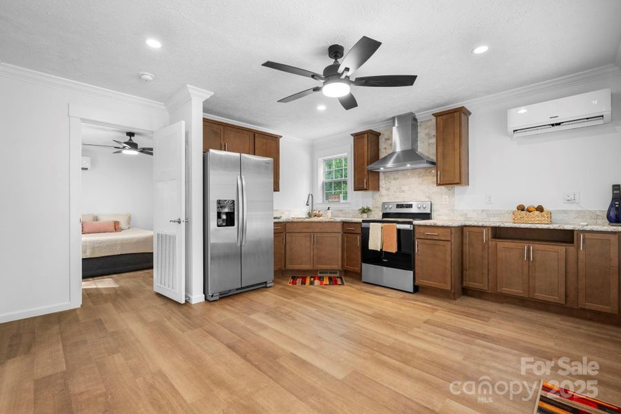 Full kitchen with vinyl plank flooring and can lighting!!