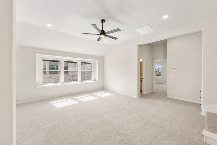 Empty living room with carpet, ceiling fan, recessed lighting, and triple window Empty living room with carpet, ceiling fan, recessed lighting, and triple window