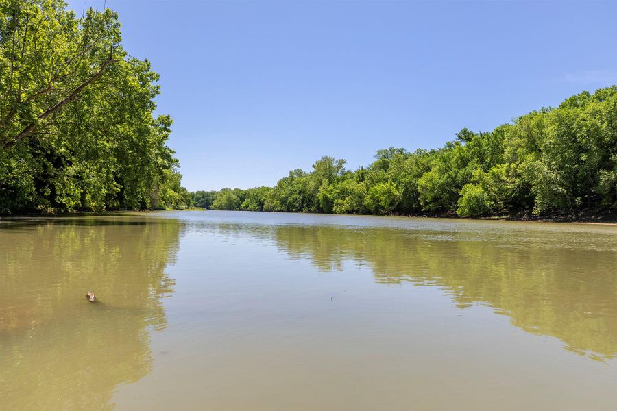 Water view featuring a heavily wooded area
