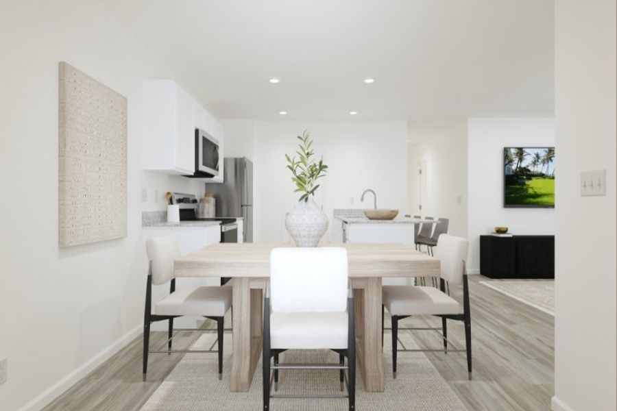 A dining room with a table and chairs. A dining room with a table and chairs.