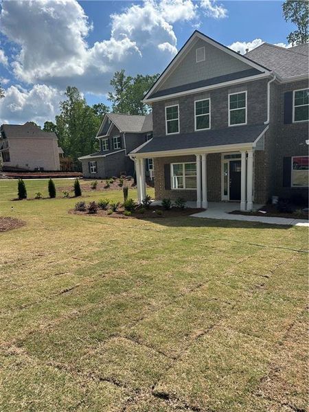 Front exterior of a new home in Mirror Lake at South Harbour, Villa Rica, GA, highlighting curb appeal (Image 19).