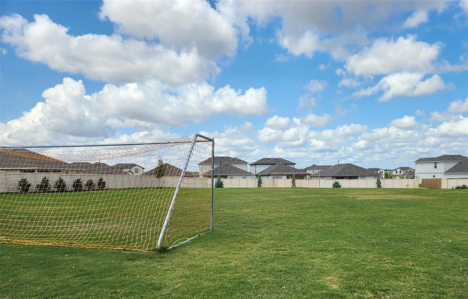 View of home's community with an area for soccer and a residential view