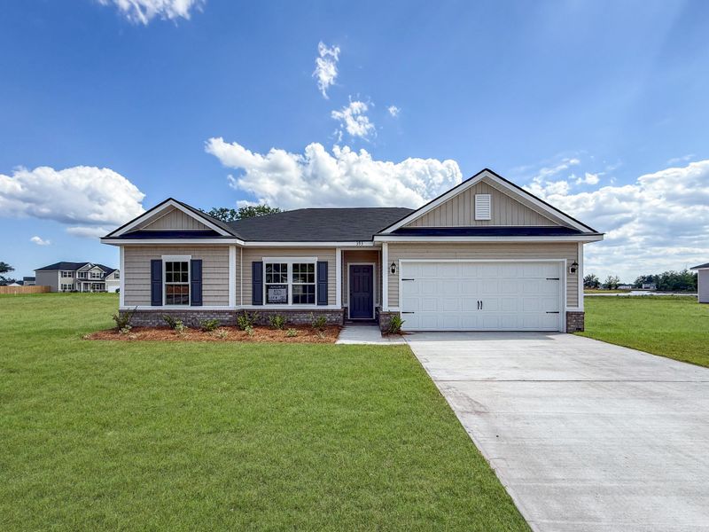 Front exterior of a new home in The Village at Sassafras, Allenhurst, GA, highlighting curb appeal (Image 1). Front exterior of a new home in The Village at Sassafras, Allenhurst, GA, highlighting curb appeal (Image 1).