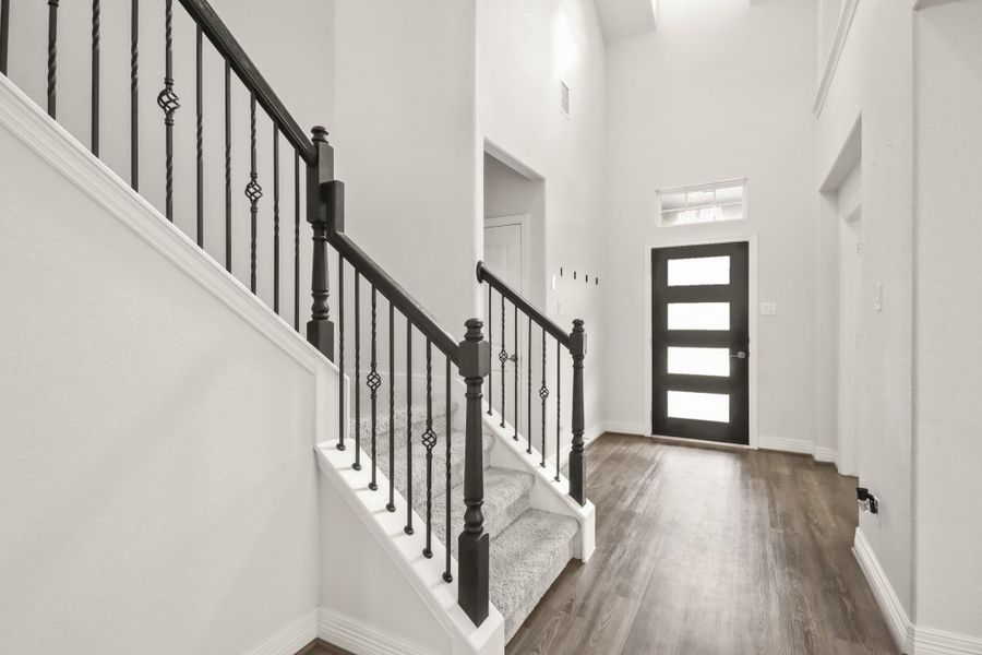 Your 2 story grand foyer pictured with the second story balcony above