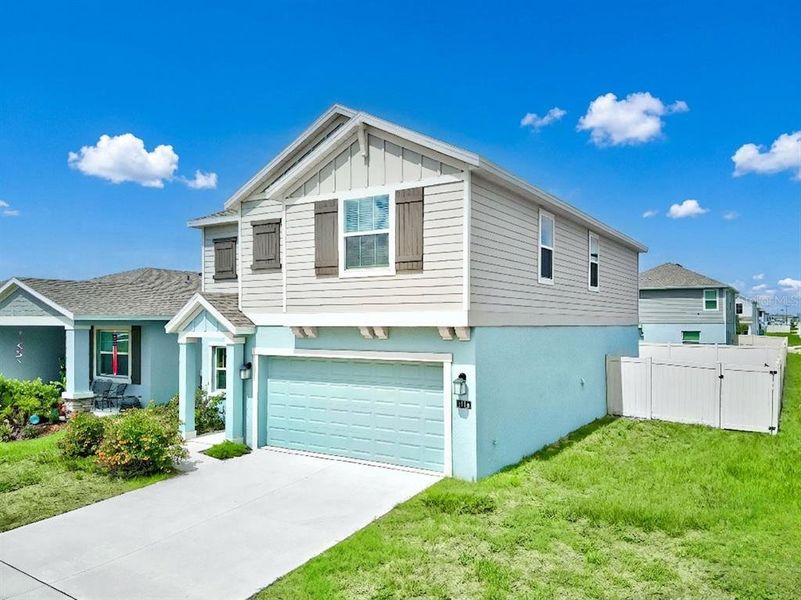 Front exterior of a new home in Ranches at Lake Mcleod, Eagle Lake, FL, highlighting curb appeal (Image 22).