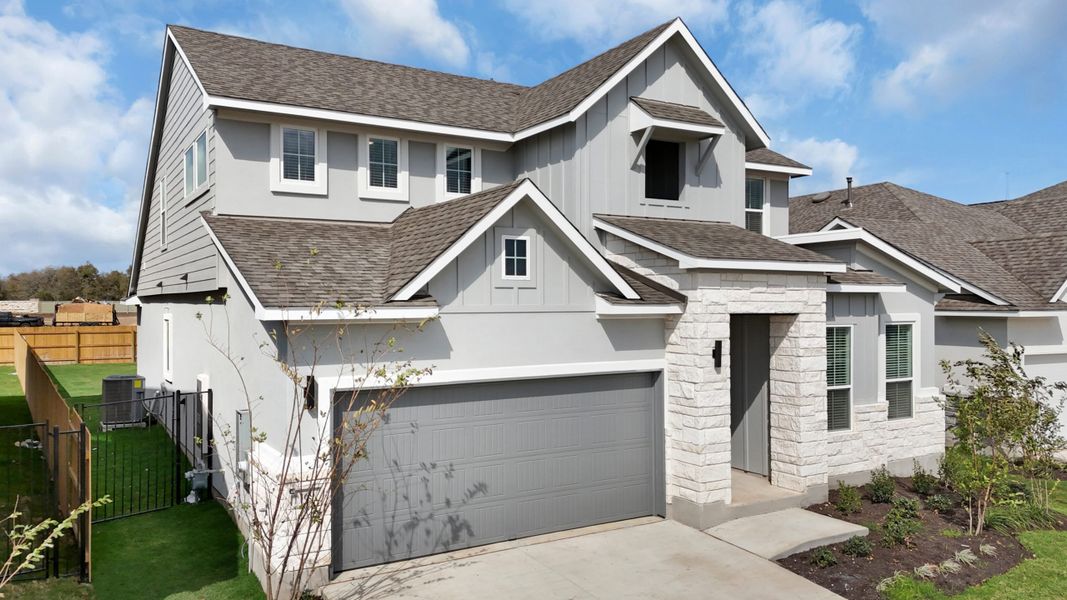 Front exterior of a new home in Santa Rita Ranch, Liberty Hill, TX, highlighting curb appeal (Image 29).