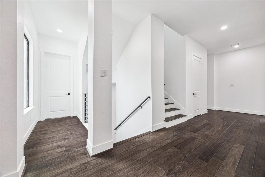 The second-floor landing offers a generous, open space that serves as a bright and elegant transition between bedrooms and living areas.