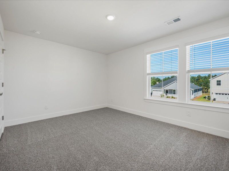 Spacious, unfurnished interior of a new home in The Coves at Lakes of Cane Bay II, Summerville (Image 31). Spacious, unfurnished interior of a new home in The Coves at Lakes of Cane Bay II, Summerville (Image 31).