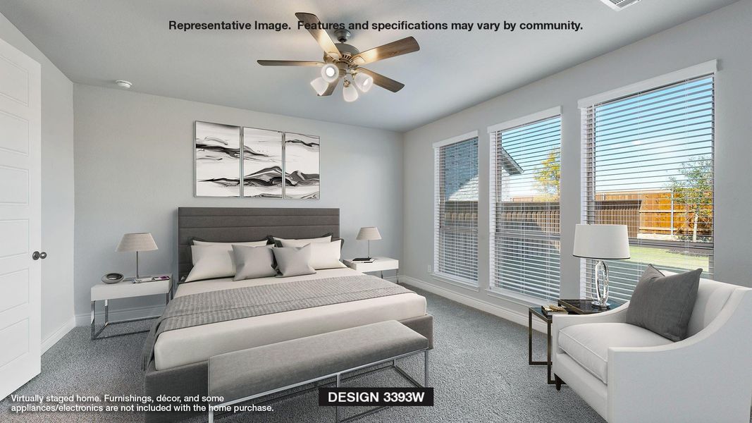 Carpeted bedroom featuring multiple windows and ceiling fan Carpeted bedroom featuring multiple windows and ceiling fan