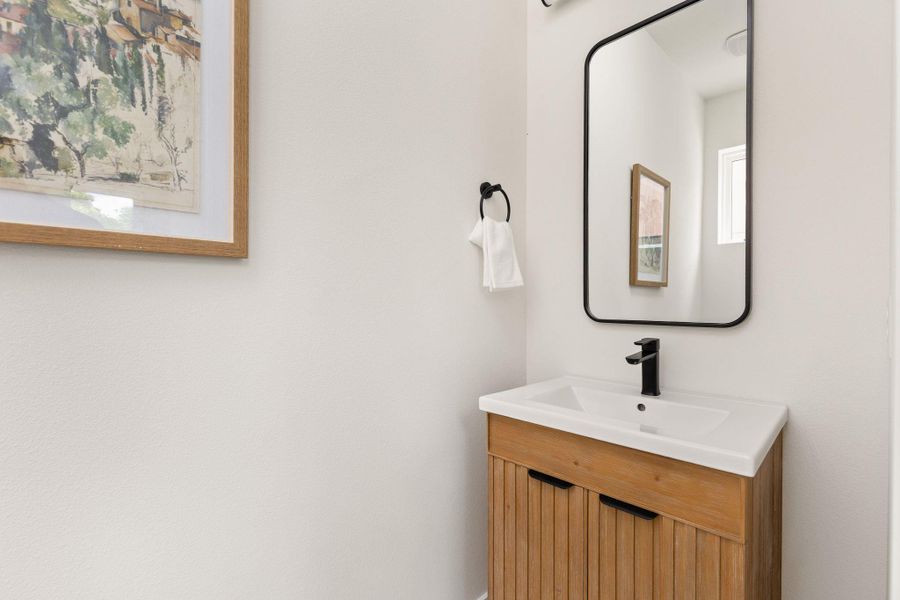 Modern vanity and mirror create a chic and functional space for daily routines. Modern vanity and mirror create a chic and functional space for daily routines.