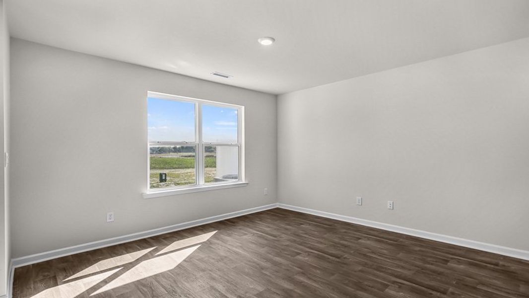Spacious, unfurnished interior of a new home in Edinborough Townes, Gibsonville (Image 9).