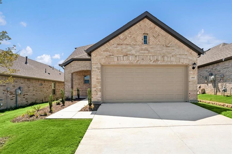 Front exterior of a new home in ValleyBrooke, Mesquite, TX, highlighting curb appeal (Image 24). Front exterior of a new home in ValleyBrooke, Mesquite, TX, highlighting curb appeal (Image 24).