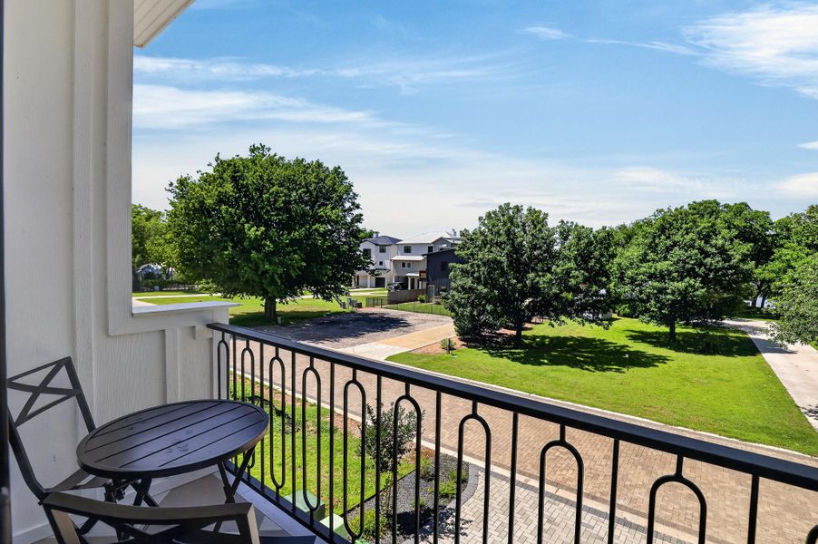 A tranquil balcony provides verdant neighborhood views and a refreshing outdoor retreat. A tranquil balcony provides verdant neighborhood views and a refreshing outdoor retreat.