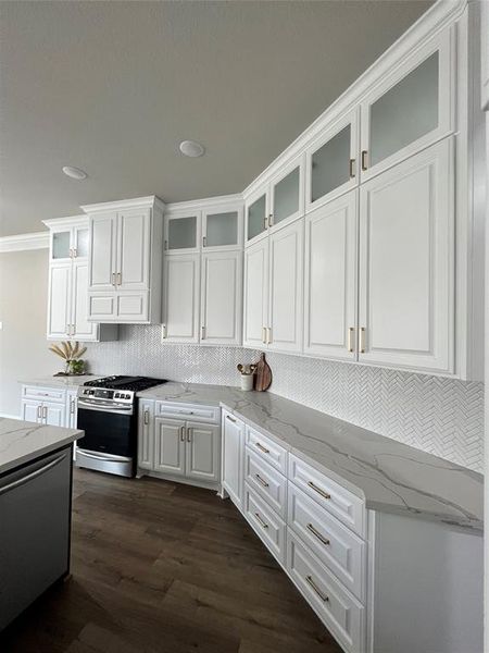 Other Interior Picture of a Similar Kitchen With a View of the Cabinets and Backsplash Built By Tx Best Home Builders.