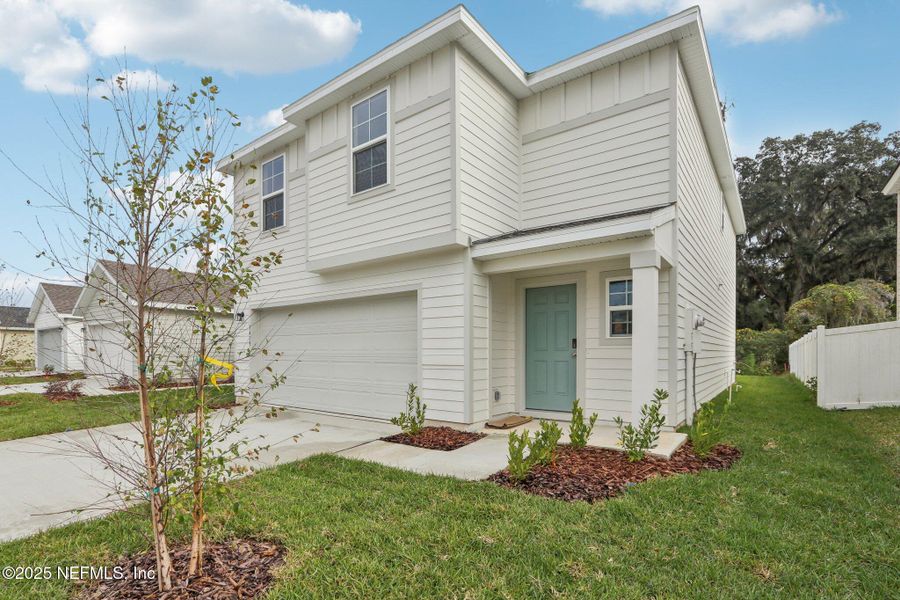 Front exterior of a new home in Kings Landing, Jacksonville, FL, highlighting curb appeal (Image 27). Front exterior of a new home in Kings Landing, Jacksonville, FL, highlighting curb appeal (Image 27).
