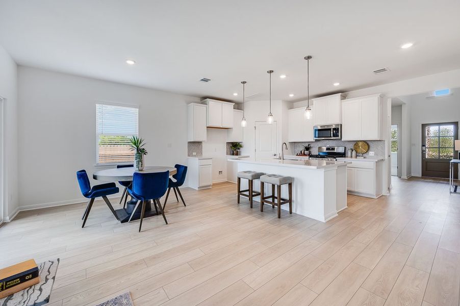 Representative furnished interior of a home built from the Sparrow by Taylor Morrison in Turner's Crossing 50s, Austin (Image 7).