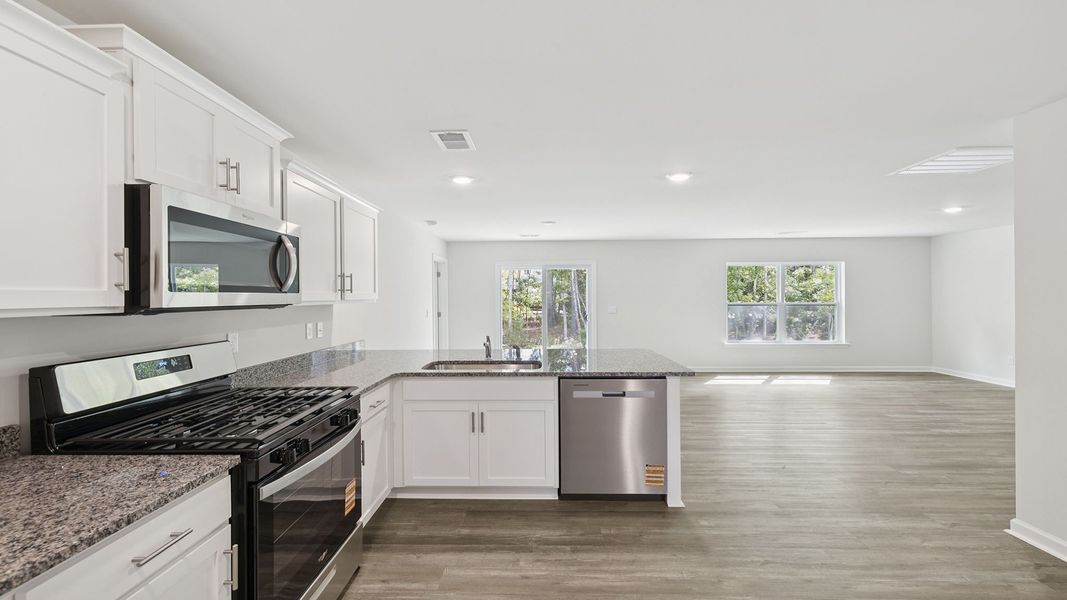 Furnished interior view inside a new home in Bentley Park, Greenwood (Image 7).
