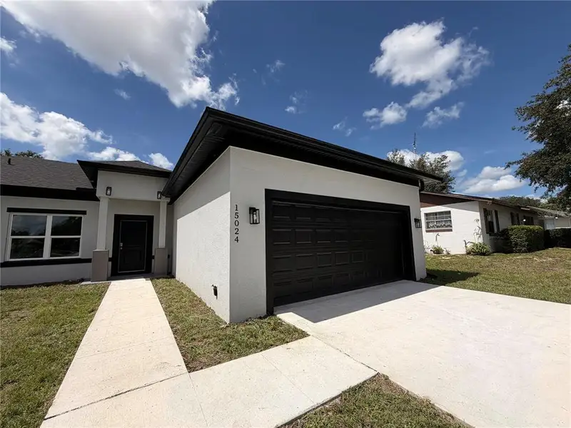 Front exterior of a new home in , Ocala, FL, highlighting curb appeal (Image 2). Front exterior of a new home in , Ocala, FL, highlighting curb appeal (Image 2).