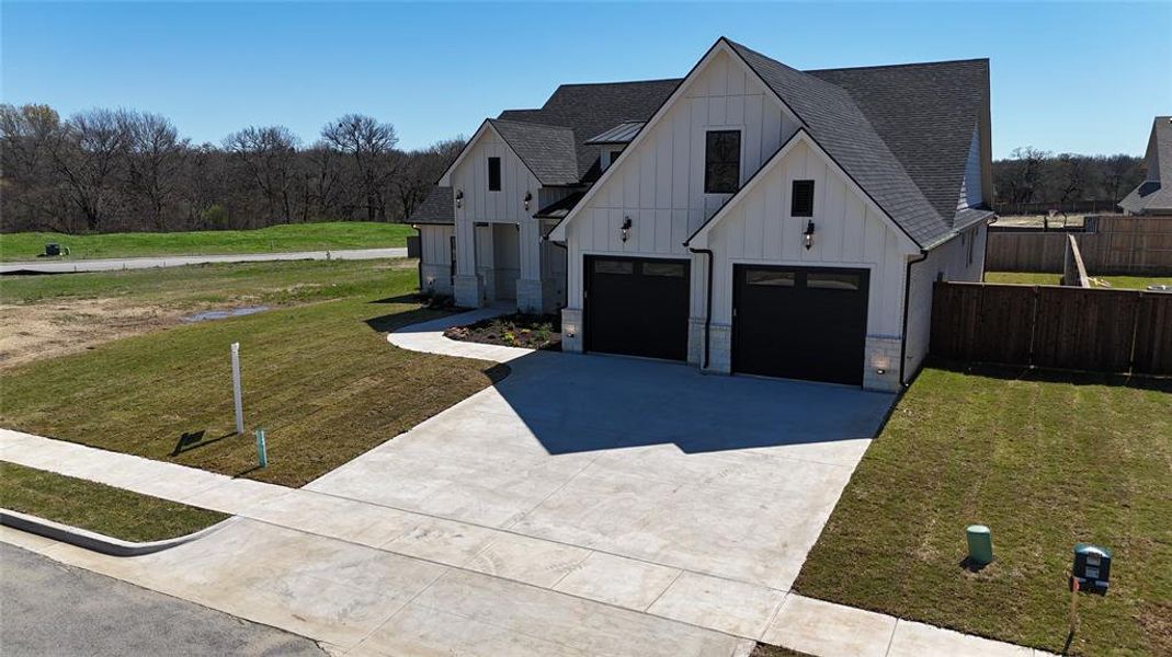 Front exterior of a new home in , Pottsboro, TX, highlighting curb appeal (Image 27).