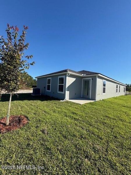 Exterior details and patio area of a home in Grand Reserve, Bunnell (Image 4).