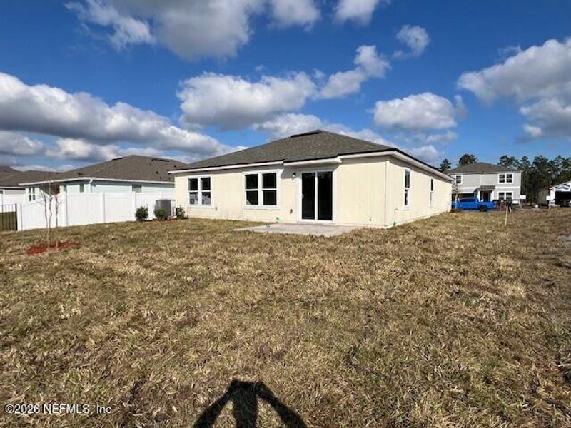 Exterior details and patio area of a home in Sawmill Branch, Palm Coast (Image 3).