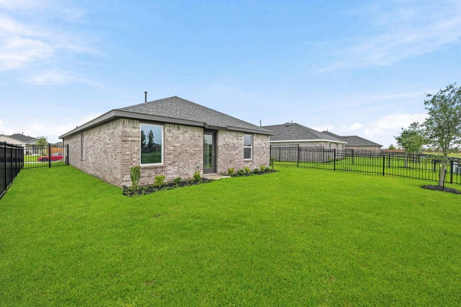 Exterior details and patio area of a home in Sunterra, Katy (Image 3).