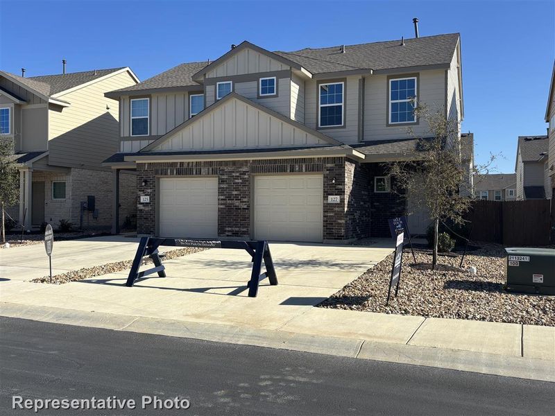 View of front of property with a garage