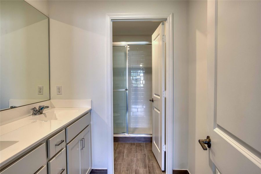 The vanity is purposely separate from the shower/toilet area for added privacy and convenience