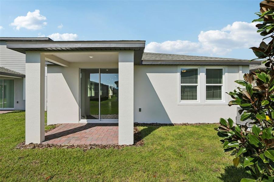 Exterior details and patio area of a home in Springs at Lake Alfred - Classic Series, Lake Alfred (Image 24).
