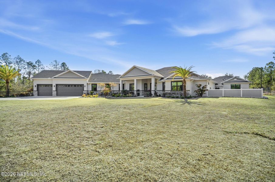 Front exterior of a new home in , Palm Coast, FL, highlighting curb appeal (Image 1). Front exterior of a new home in , Palm Coast, FL, highlighting curb appeal (Image 1).