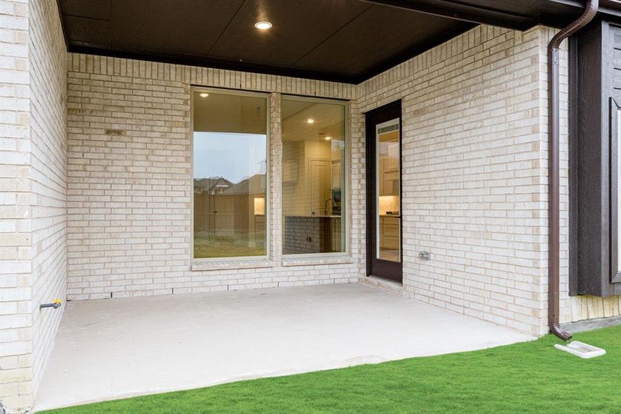 Exterior details and patio area of a home in Windsong Ranch Classic 61, Prosper (Image 3).