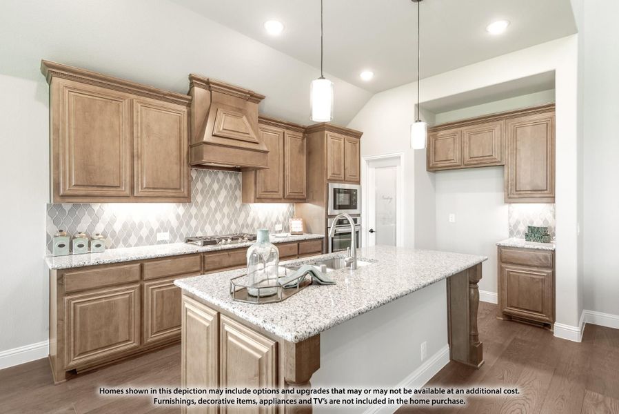 Kitchen with wood cabinets, granite island, decorative tile backsplash, and pendant lights over vaulted ceiling Kitchen with wood cabinets, granite island, decorative tile backsplash, and pendant lights over vaulted ceiling